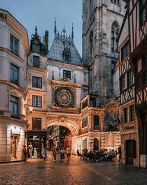 The Gros Horloge a th century astronomical clock installed in a Renaissance arch crossing a street in Rouen Normandy France