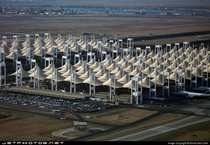 The Hajj Terminal at King Abdul Aziz International Airport in Jeddah Saudi Arabia Designed as desert tents that houses pilgrims coming for the annual pilgrimage to Mecca 