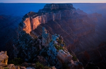 The last rays of sunset Illuminate Wotans Throne the Southernmost tip of the Walhalla Plateau on the North Rim of the Grand Canyon A thousand feet higher in altitude than the South Rim this point affords a commanding and majestic view of the Grand Canyon 