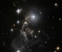 The little-known nebula IRAS  billows out among the bright stars and dark dust clouds that surround it in this striking image from the Hubble Space Telescope 