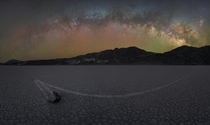 The Milky Way arch over one of the sailing rocks at the spectacular Racetrack playa in Death Valley National Park 