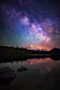 The Milky Way galaxy as drifts beyond Mt Hood as seen from the beautiful Lost Lake in Oregon 