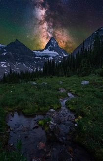 The milky way over the huge Mt Assiniboine in British Columbia Canada 