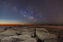 The MilkyWay with the Jupiter and Venus fading away in the predawn sky over the Jetty in Barnegat New Jersey 