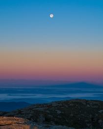 The moon above the Champlain Valley at dawn Vermont 