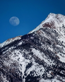 The Moon rising over the Rocky Mountains in Montana 
