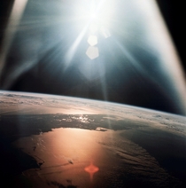 The morning sun reflects on the Gulf of Mexico and the Atlantic Ocean as seen from the Apollo  spacecraft during its th revolution of the Earth on Oct   