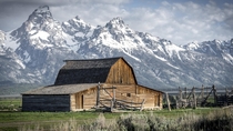 The Moulton Barn an abandoned barn in Mormon Row in Grand Teton National Park Wyoming  by Erik de Klerck