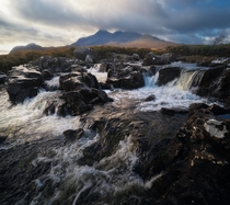 The numerous cascades around Sligachan looking towards the epic Black Cuillins Isle of Skye Scotland UK 