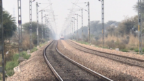 The Overhead catenary wires of the Delhi - Rewari section of Indian railways was recently upgraded to a height of m ft to allow double stack freight trains to pass through