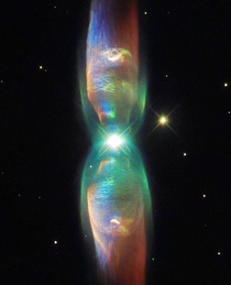 The Planetary Nebula M- also known as the Twin Jet Nebula is a result of a central binary star system pouring jets of material into space at  million km per hour