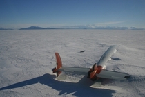 The remains of the Pegasus lie abandoned in McMurdo Sound Antarctica slowly being swallowed by the ice