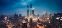 The Shanghai Three Shanghai Tower World Financial Center and Jin Mao Tower Soaring Above the Clouds 