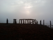 The skeleton of a pier in the fog north of Scotland Abandoned to the elements in the th century