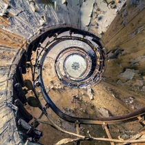 The spiral staircase of an abandoned grand hotel  by Andy Schwetz