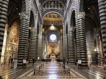 The striped marble columns of Siena Cathedral create a striking appearance Groundbreaking  completed  Tuscany Italy 
