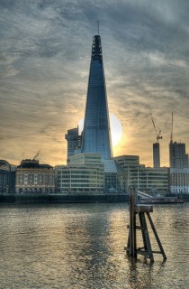 The Sun passing behind The Shard London 