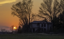 The sun sets on an abandoned farmhouse in Fairfield County Ohio    Sean Denney