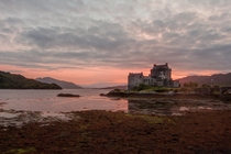 The sun setting over the wonderful Eilean Donan Castle located in the western Scottish Highlands