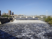 The Third Avenue Bridge over the Mississippi in Minneapolis with the upper Saint Anthony Falls dam and lock in the foreground 