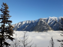 The top of the Highline mountain pass near Seaton Portage BC above the valley fog 