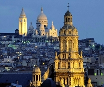 The towers of Montmartre Sacre-Coeur Basilica and the Church of the Holy Trinity 