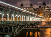 The western part of the Pont de Bir-Hakeim seen at nightwith buildings of the th arrondissement of Paris visible in the background 