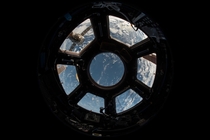 The windows of the International Space Station are registered by a fisheye lens in a photo taken by members of Expedition   StationCDRKelly  Twitter