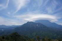 This beautiful lenticular cloud casting over Mount Kinabalu Malaysia 