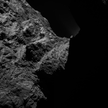 This image of comet PChuryumov-Gerasimenko was obtained on October   by the OSIRIS scientific imaging system on the Rosetta spacecraft The right half is obscured by darkness The image was taken from a distance of approximately  miles