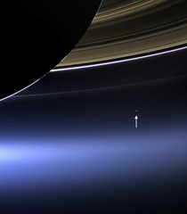 This is what Earth looks like from  billion kilometers away the Cassini spacecraft spots a pale blue dot beneath Saturns rings
