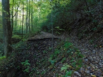 This section of Old Highway  has been abandoned for over  years after the highway was rerouted during the construction of New Highway  which shortened the drive from Tellico Plains to the mountain community of Coker Creek Coker Creek TN