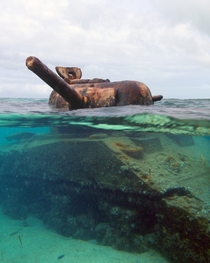 This Sherman M Tank was stranded on the reef during the invasion of the island of Saipan during WWII Its turret is still frozen in time taking aim at a Japanese gun emplacement on the beach 