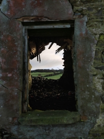 Through the ruins of an abandoned farm house Ireland