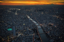 Tokyo at sunset  Photograph by Sandro Bisaro