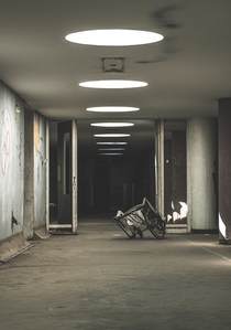 Took this image in a local abandon hospital in South Africa It is just an ominous hallway with a DIY wheelchair in the frame