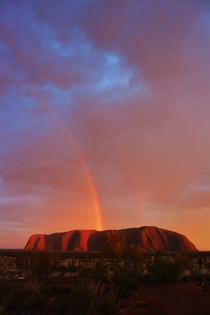 Uluru Ayers Rock treated us to a pretty spectacular full double rainbow at dawn As rare as it was beautiful 