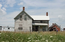 Vacant farmhouse west of St Paul Iowa 