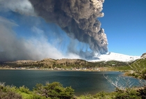 View of Copahue volcano spewing ash behind the lagoon of Caviahue Neuquen province Argentina some  km southwest of Buenos Aires on December   