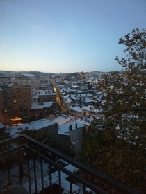 View of Saint-tienne France from my balcony sunset light and snow under the clear sky 