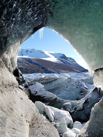 View through an ice tunnel on Svnafellsjokull glacier in Skaftafell National Park Iceland 