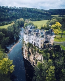 Walzin Castle on a cliff overlooking the river Lesse a castle that started construction in the th century and was restored several times since Namur Wallonia Belgium