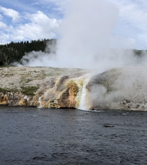 Water from Grand Prismatic Spring flowing into the Firehole River Yellowstone National Park   x 