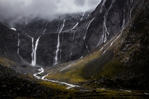 Waterfalls near the mouth of the Homer Tunnel New Zealand Photograph by Travis Daldy 