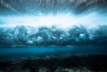 Waves crash onto the Cook Islands reef captured in almost slow motion as part of photographer Mark Tipples The Underwater Project 