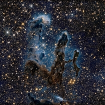 We all know the image of the Pillars of Creation taken by the Hubble telescope Here is a new image of NASA the pillars seen in infrared light that pierces through dust and gas and offers an unknown view