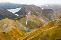 We walked across this spectacular valley of colorful mountains with a neat river down the gorge Never knew this place could be so geologically varied and beautiful Iceland 
