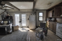Wheelchair Sitting Inside the Kitchen of an Abandoned House in Rural Ontario Canada 