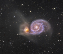 Whirlpool Galaxy Deep Field -- A stunning pair of interacting galaxies NGC s right spiral arms and dust lanes clearly sweep in front of its companion galaxy left NGC  