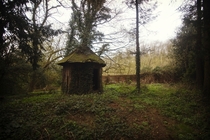 Woodern hut behind a derelict manor   x 